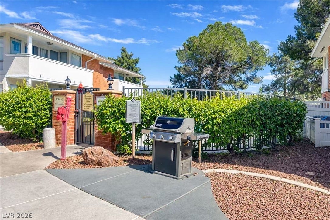 2838 Loveland Drive, #1608, Las Vegas, NV 89109 A dedicated outdoor grilling area rests adjacent to the gated community pool entrance.