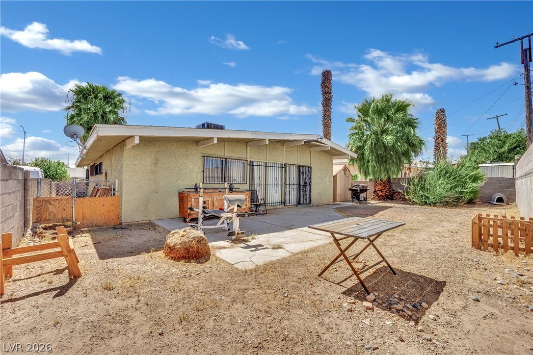 A spacious backyard area includes a concrete patio and plenty of room to customize.
