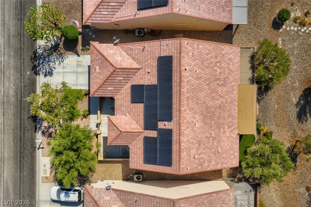 7421 Shelduck Street, North Las Vegas, NV 89084 Solar panels integrate seamlessly with the classic tile roof of this desert home.