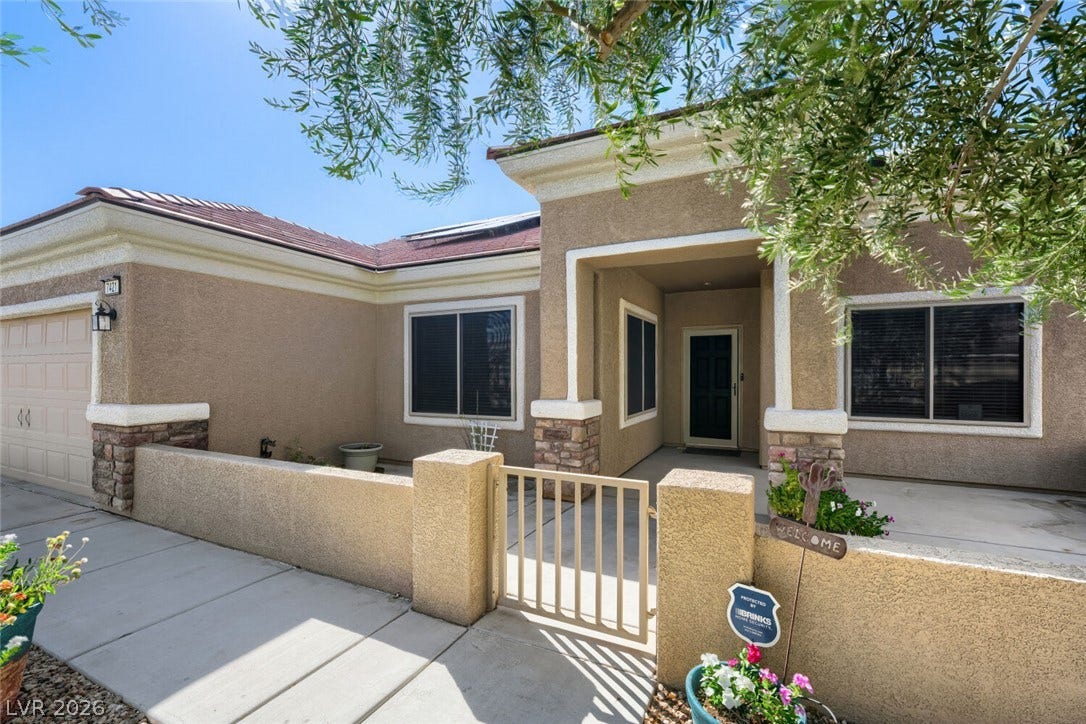 7421 Shelduck Street, North Las Vegas, NV 89084 A gated front courtyard welcomes you to this classic stucco exterior with stone accents.