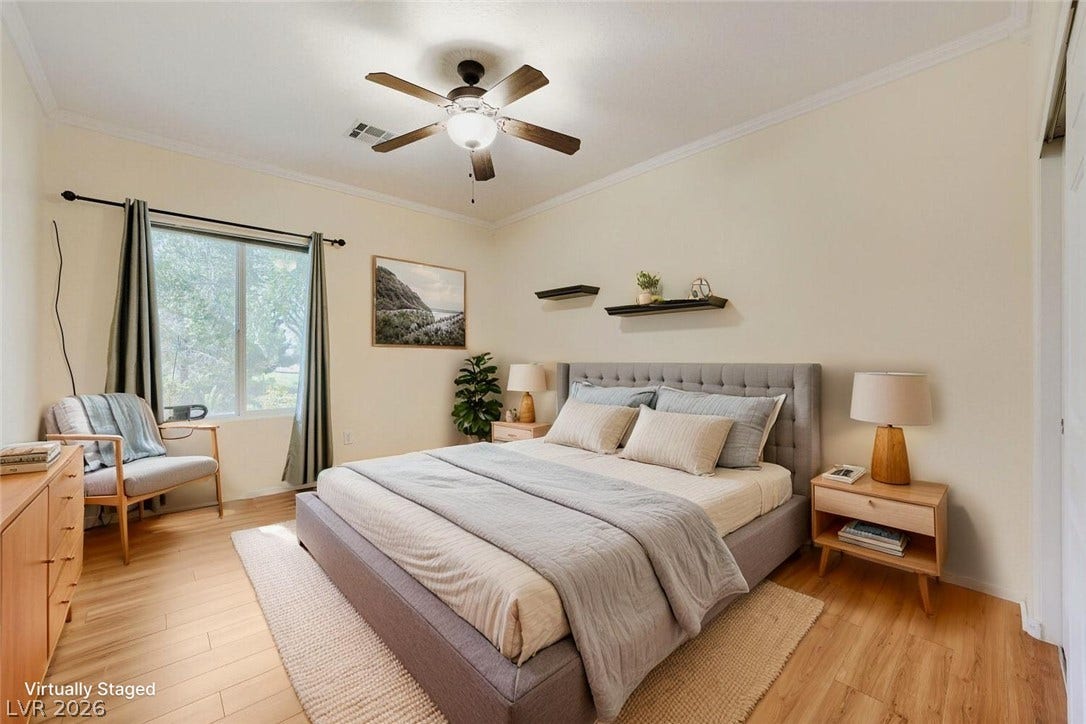 7421 Shelduck Street, North Las Vegas, NV 89084 Gleaming hardwood floors and a classic crown molding trim define this peaceful bedroom retreat.