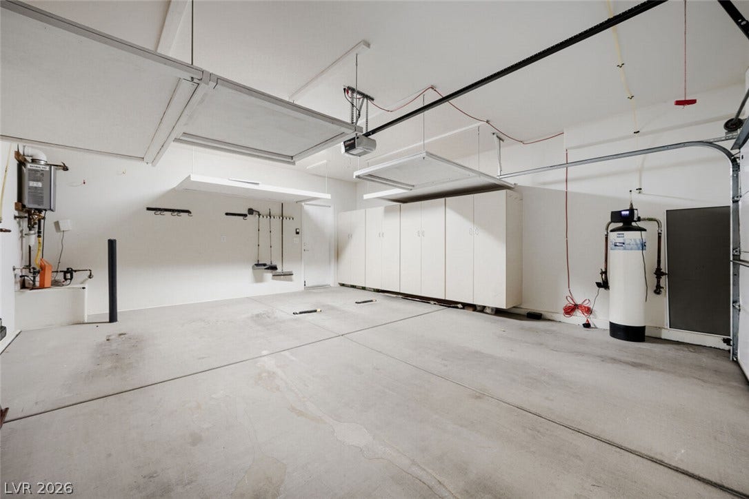7421 Shelduck Street, North Las Vegas, NV 89084 An finished, organized garage with built-in storage cabinets, tankless water heater, and water filter