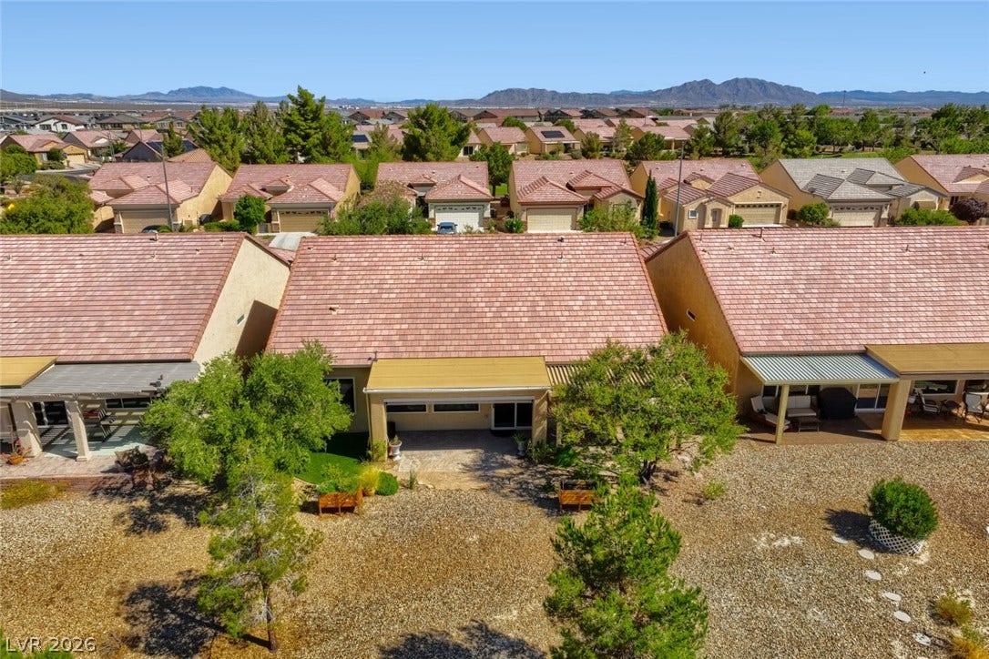 7421 Shelduck Street, North Las Vegas, NV 89084 An elevated perspective showcases the tiled rooflines, covered patios, and distant mountain views.