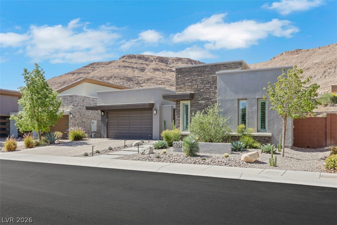 Welcome home to modern luxury where refined sleek architectural designs meets a breathtaking mountain backdrop.