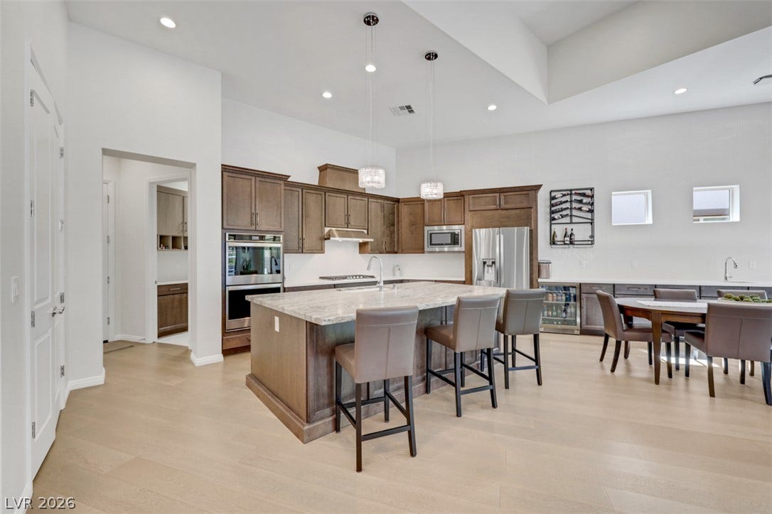 Gleaming wood floors anchor a gourmet space highlighted by a generous center island.