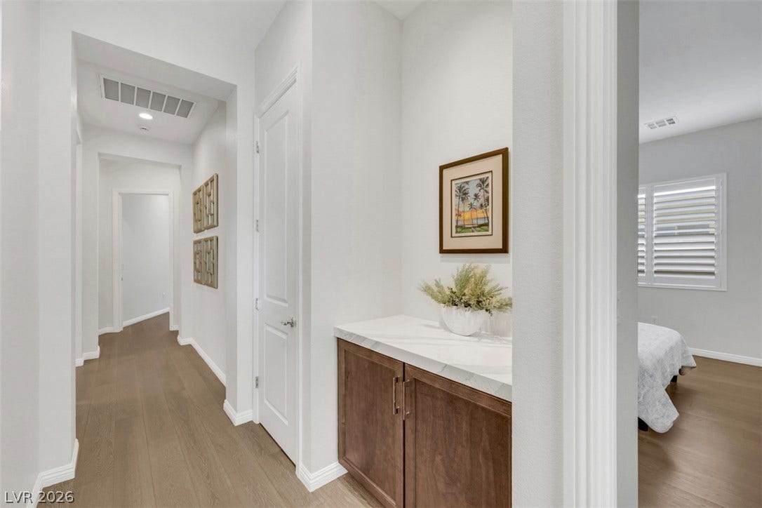 A stunning quartz-topped display area with dedicated art lighting creates an elegant focal point, perfectly designed to showcase beautifully designed illuminate your favorite artwork.