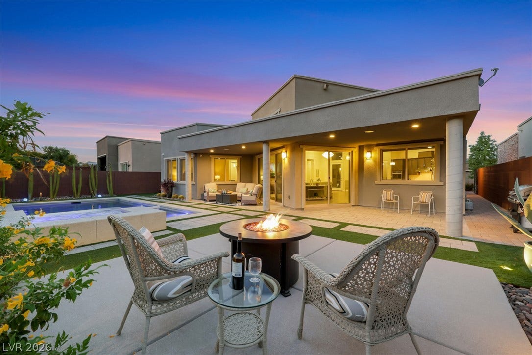 An inviting outdoor terrace complement the home's sleek modern architecture.