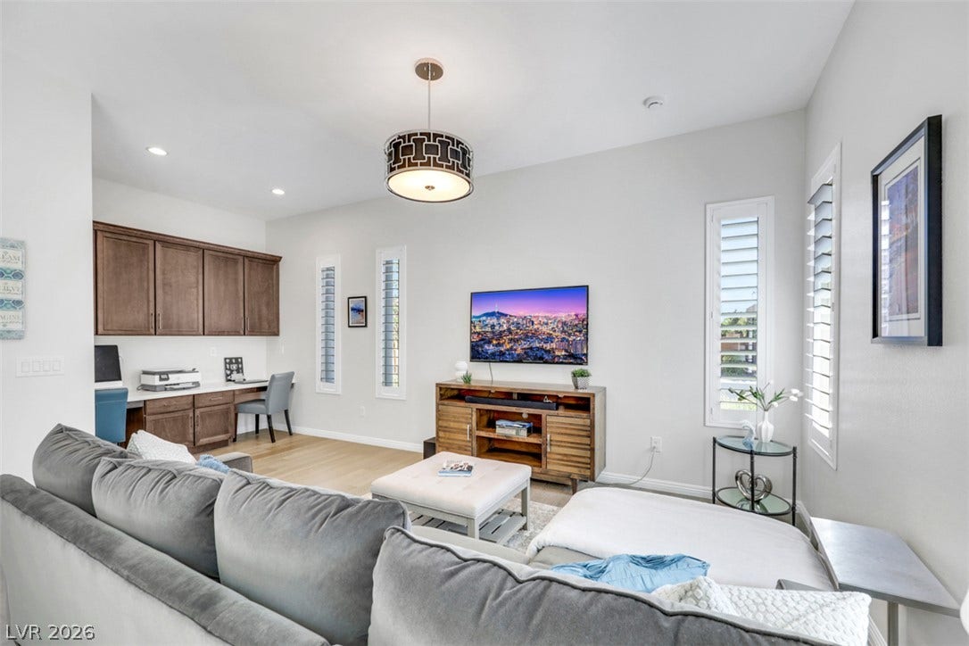 Sophisticated multi-generational space featuring rich wood cabinetry with abundant storage and dedicated office area.