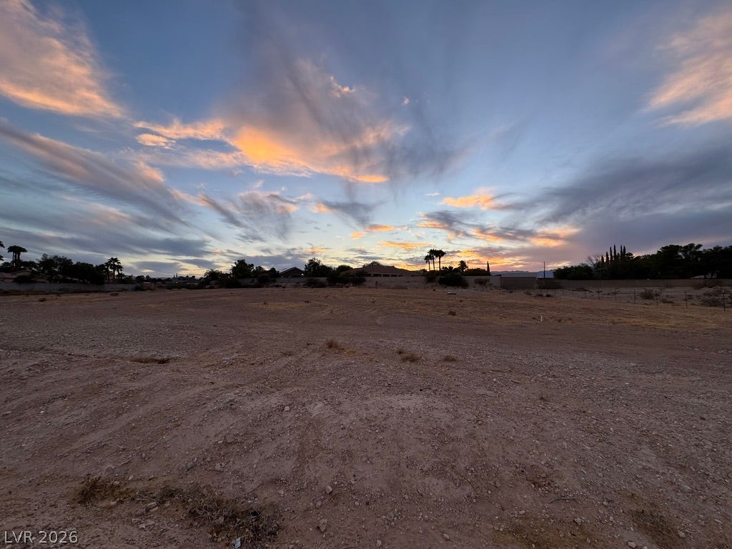 Lindell, Las Vegas, NV 89118 Dramatic sunset skies frame a level, open desert lot ready for custom development.