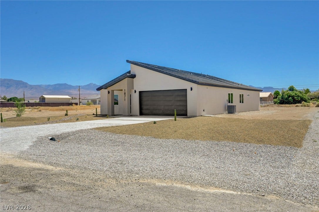 Clean lines and a modern shed roof design define this desert home's striking exterior.