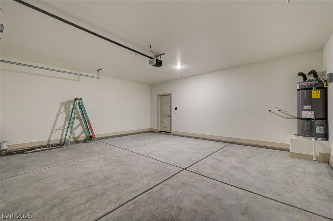 Smooth concrete floors and freshly finished walls define this pristine, versatile vehicle storage area.