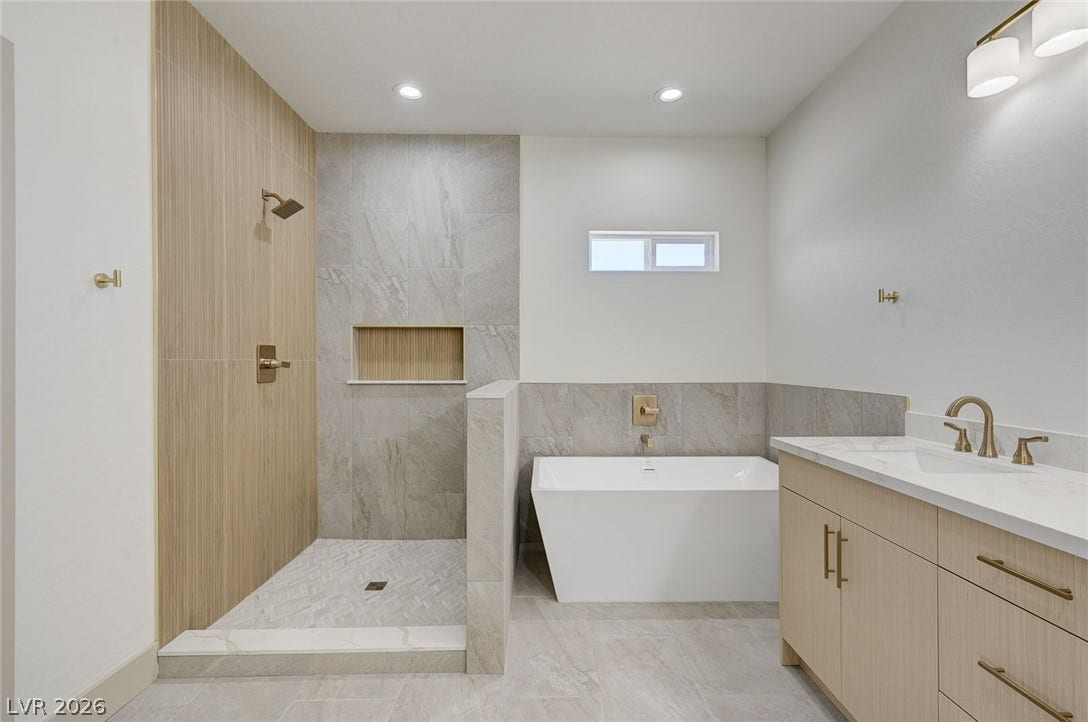 Clean lines and a freestanding tub define this contemporary master bath oasis.