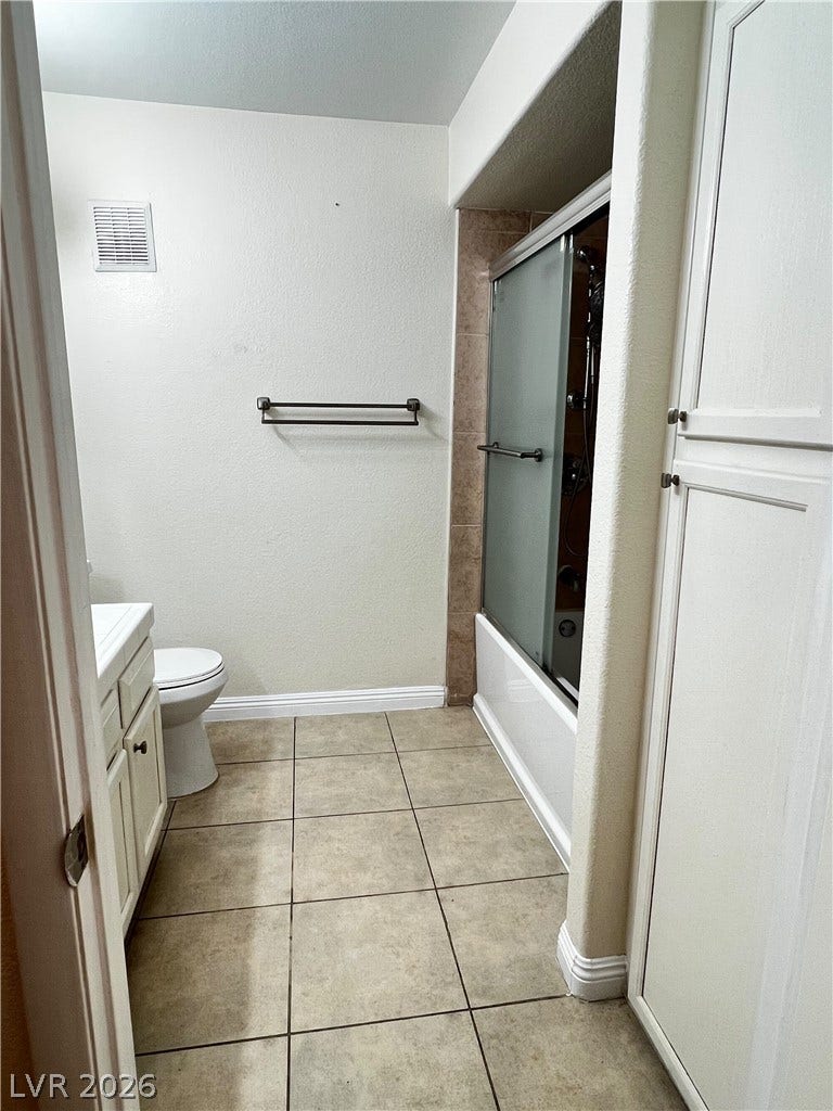 7950 W Flamingo Road, #1128, Las Vegas, NV 89147 A functional bathroom boasts durable tile flooring alongside a combined tub and shower setup.