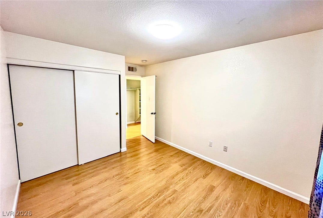 7950 W Flamingo Road, #1128, Las Vegas, NV 89147 Smooth wood floors and sliding closet doors define this versatile interior space.