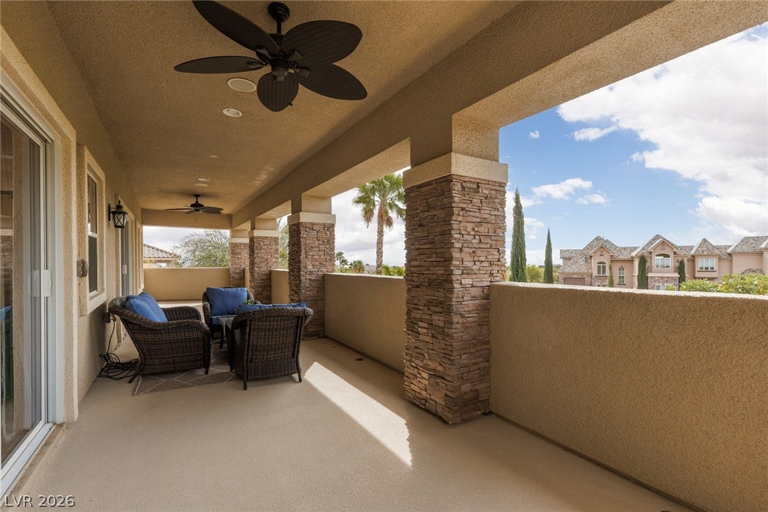 9795 Amador Ranch Avenue, Las Vegas, NV 89149 Stone-accented pillars support a covered balcony overlooking scenic neighborhood views.