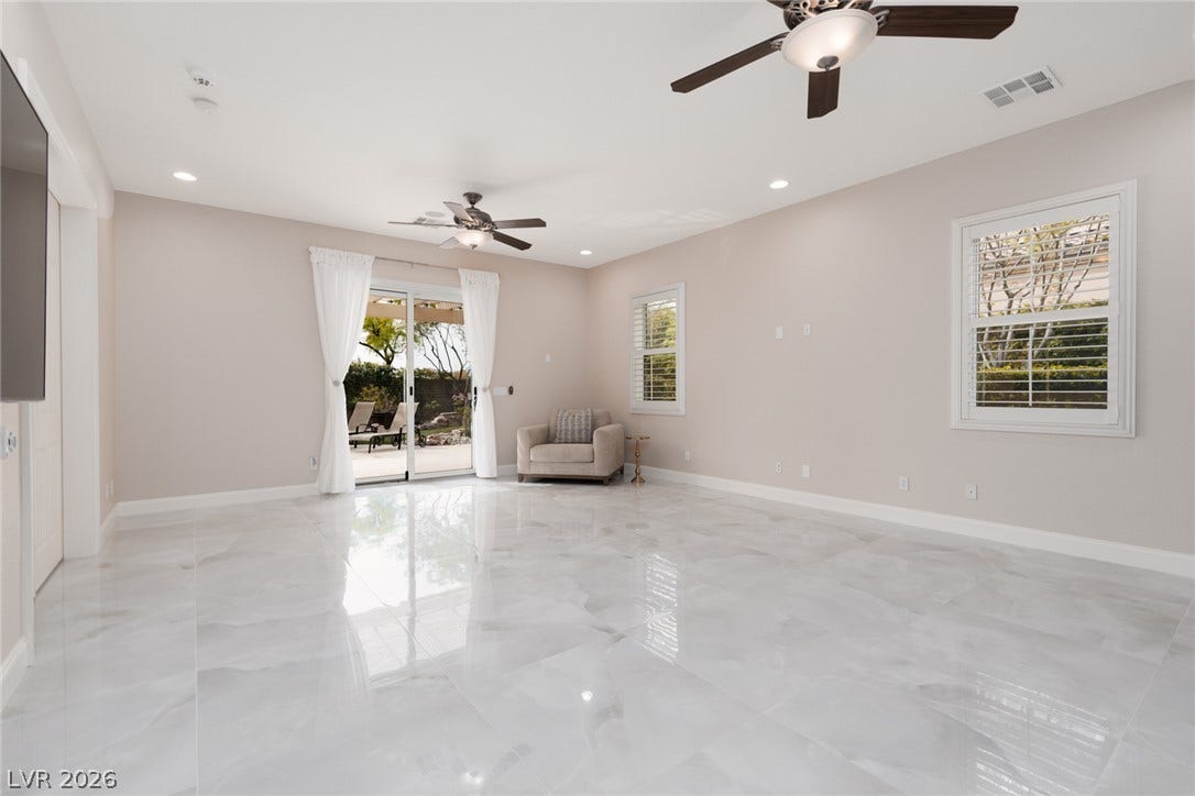 9795 Amador Ranch Avenue, Las Vegas, NV 89149 Polished tile floors and recessed lighting enhance this airy, open living area.