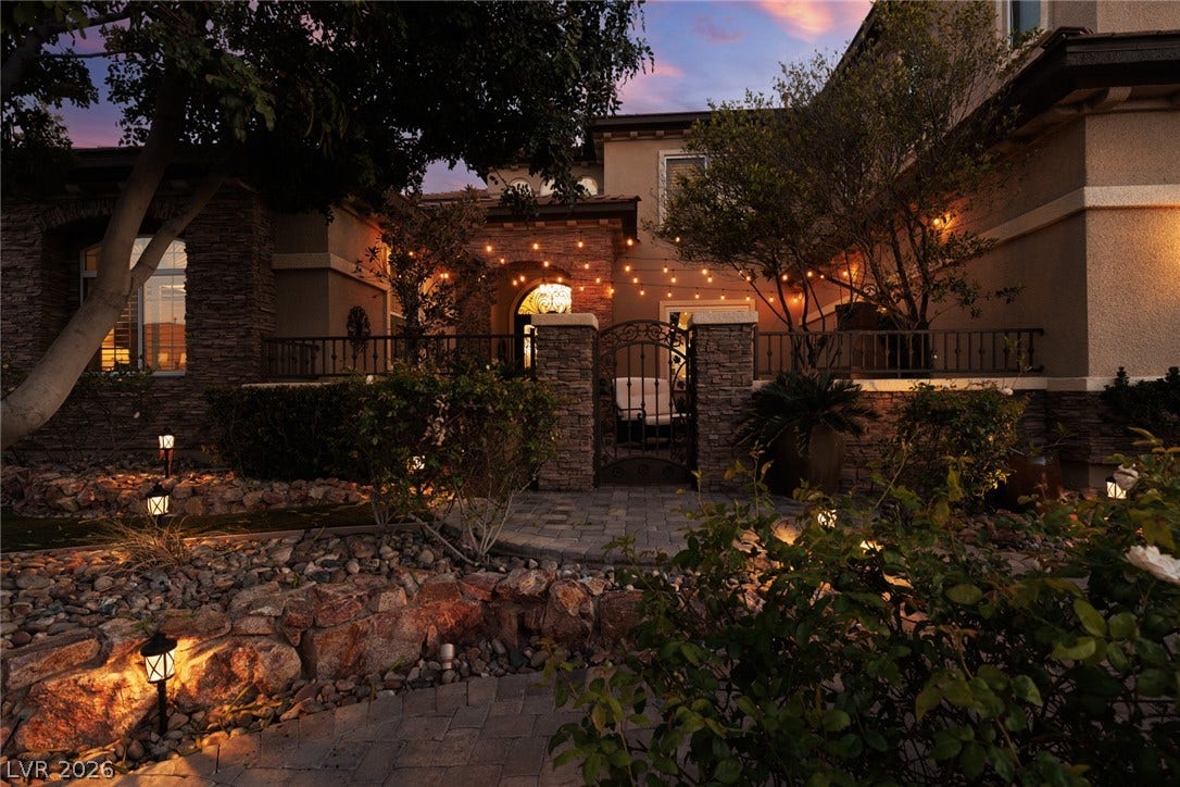 9795 Amador Ranch Avenue, Las Vegas, NV 89149 Stone accents and illuminated walkways create a warm, inviting entrance to this beautiful multi-level home.