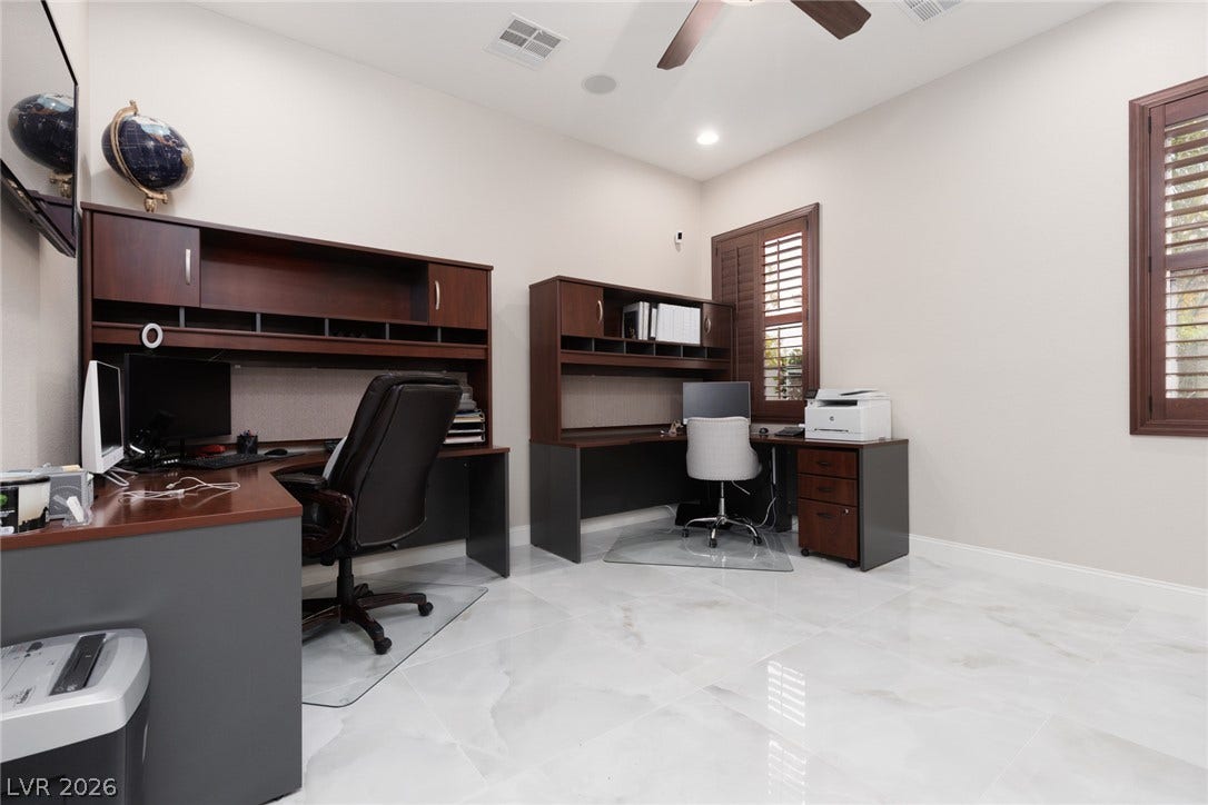 9795 Amador Ranch Avenue, Las Vegas, NV 89149 Polished tile flooring and plantation shutters define this versatile workspace.