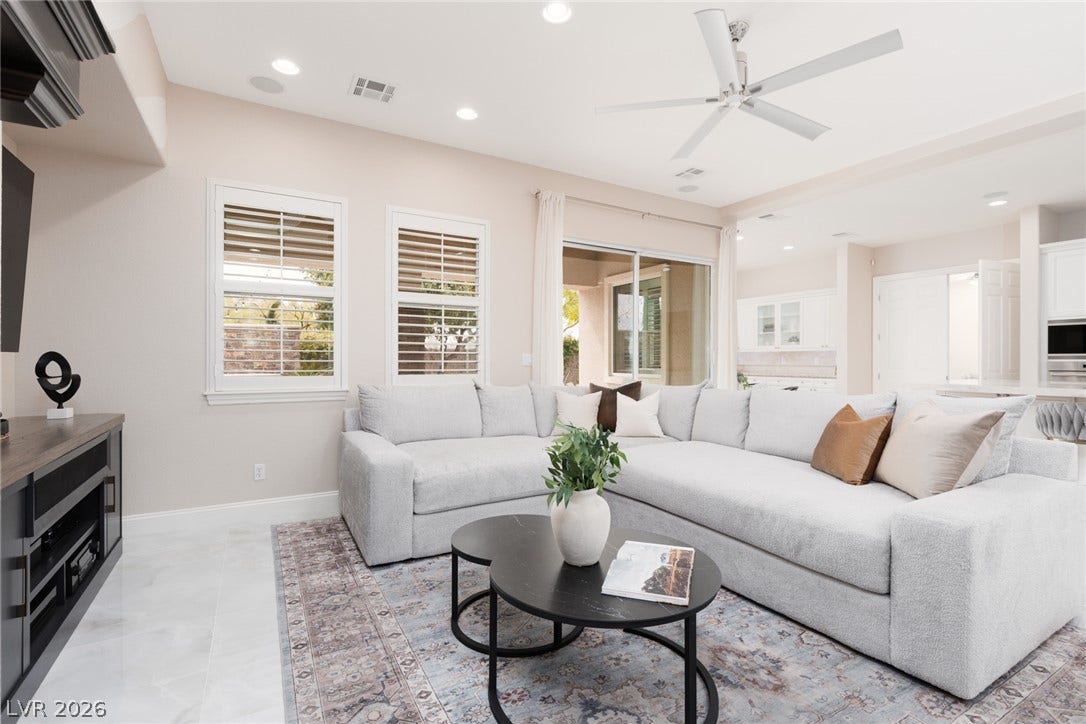 9795 Amador Ranch Avenue, Las Vegas, NV 89149 Recessed lighting and tile floors define this airy, open-concept living space.