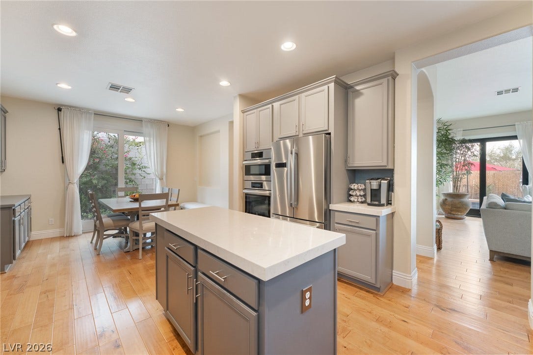 3033 Via Meridiana, Henderson, NV 89052 An open floorplan seamlessly connects the central island kitchen to neighboring living and dining zones.