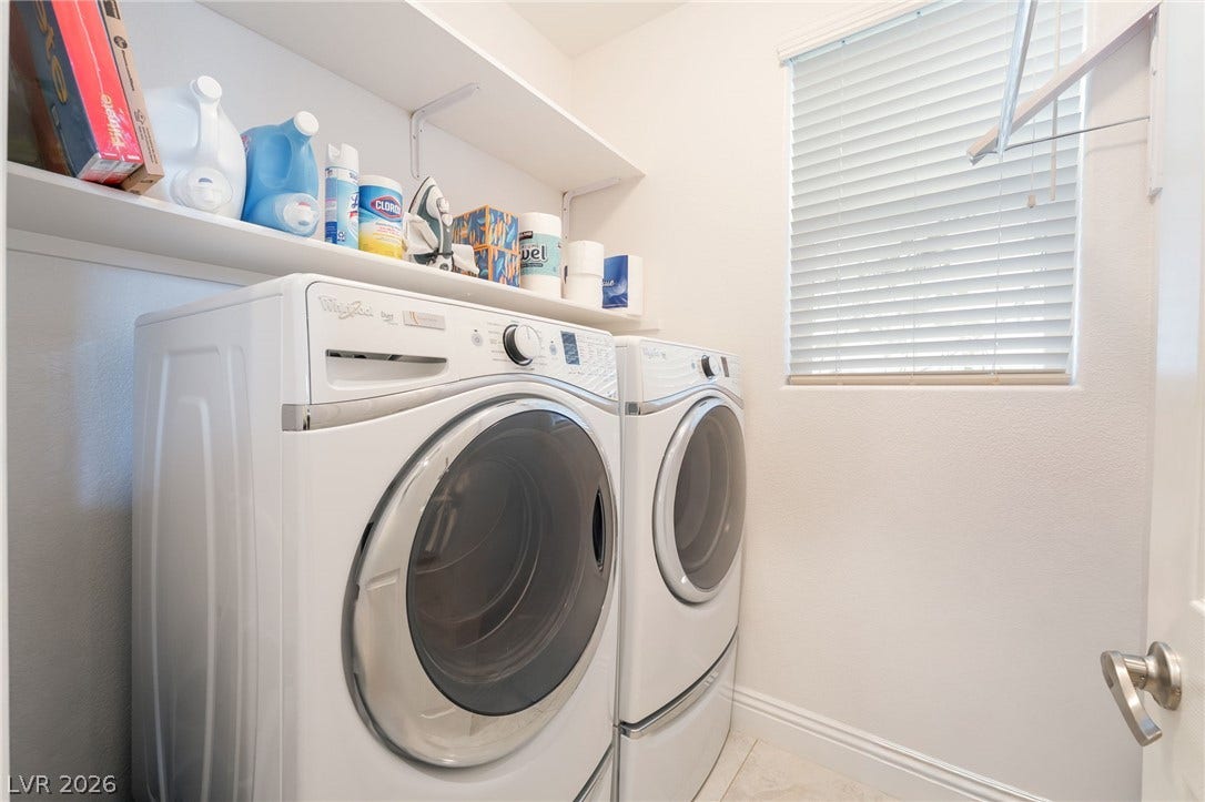 3033 Via Meridiana, Henderson, NV 89052 Functional utility space features overhead storage shelves and a large window providing natural light.