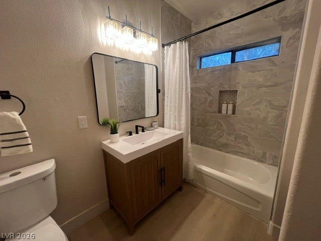 2131 Hussium Hills Street, #208, Las Vegas, NV 89108 A modern bathroom features a tiled shower surround and a warm wood vanity.
