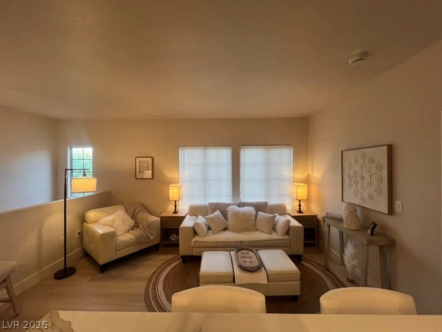 2131 Hussium Hills Street, #208, Las Vegas, NV 89108 A spacious, open-concept layout connects the living spaces under warm, recessed lighting.