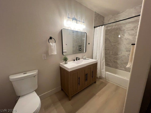 2131 Hussium Hills Street, #208, Las Vegas, NV 89108 A modern bathroom features a single vanity, tiled shower surround, and light wood flooring.