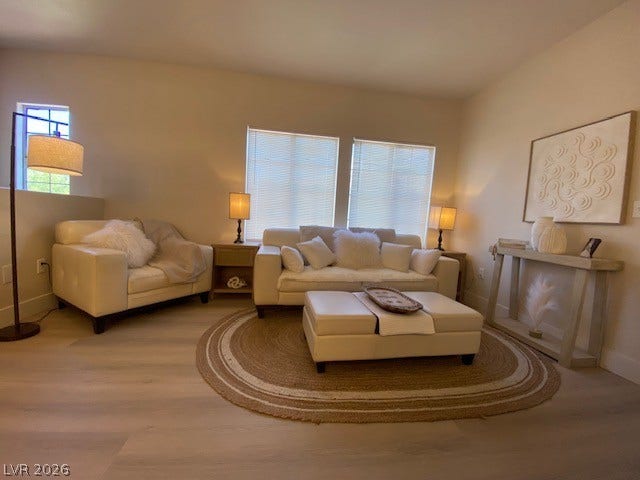 2131 Hussium Hills Street, #208, Las Vegas, NV 89108 Clean lines and smooth flooring define this inviting, light-filled sitting area.