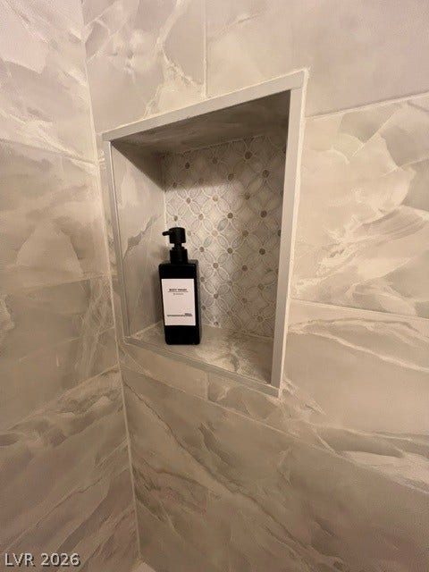 2131 Hussium Hills Street, #208, Las Vegas, NV 89108 Elegant tile work and a custom built-in niche elevate this modern shower.