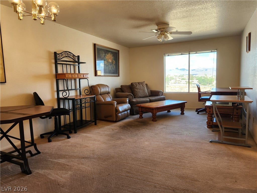 2016 Mesquite Lane, #303, Laughlin, NV 89029 Plentiful natural light fills a versatile living space featuring neutral carpeting, ceiling fan, wet bar and sweeping views of the gorgeous desert landscape.