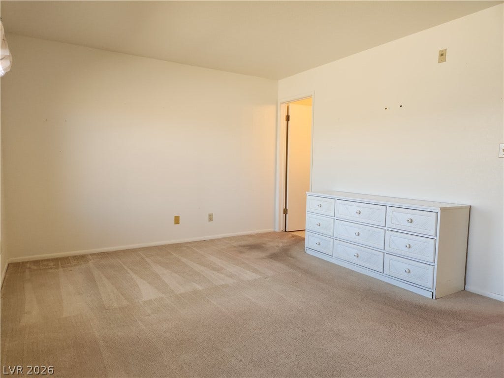 2016 Mesquite Lane, #303, Laughlin, NV 89029 An open bedroom layout features wall-to-wall carpeting and and private en-suite.