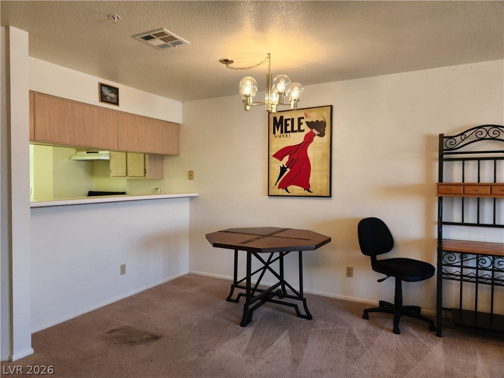 2016 Mesquite Lane, #303, Laughlin, NV 89029 An open pass-through breakfast bar connects this living space to the kitchen.