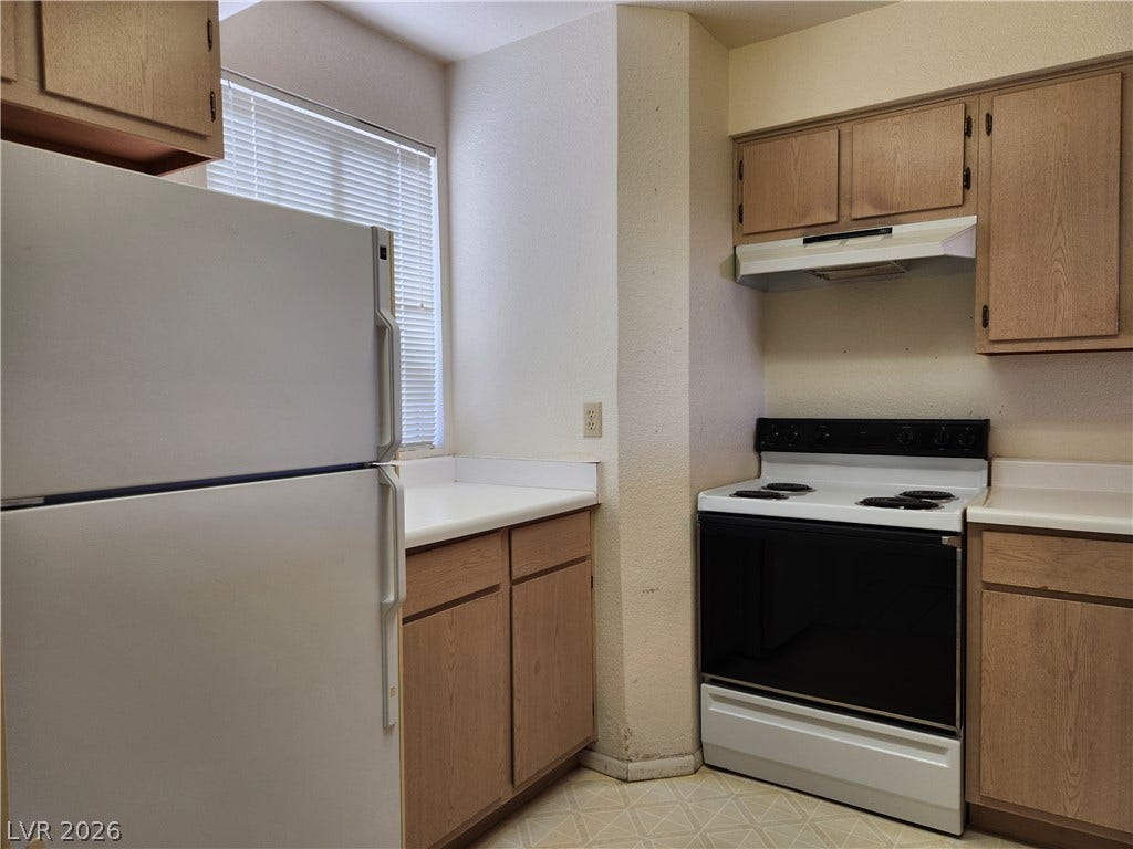 2016 Mesquite Lane, #303, Laughlin, NV 89029 Functional kitchen design features ample counter and cabinet space and a window for added natural light.