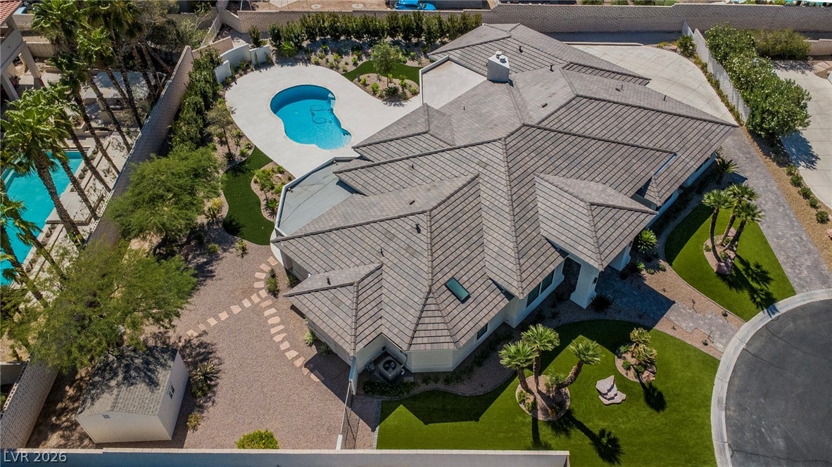 1508 Ten Palms Court, Las Vegas, NV 89117 An aerial perspective showcases the sprawling tile roof, private swimming pool, and manicured desert landscaping.