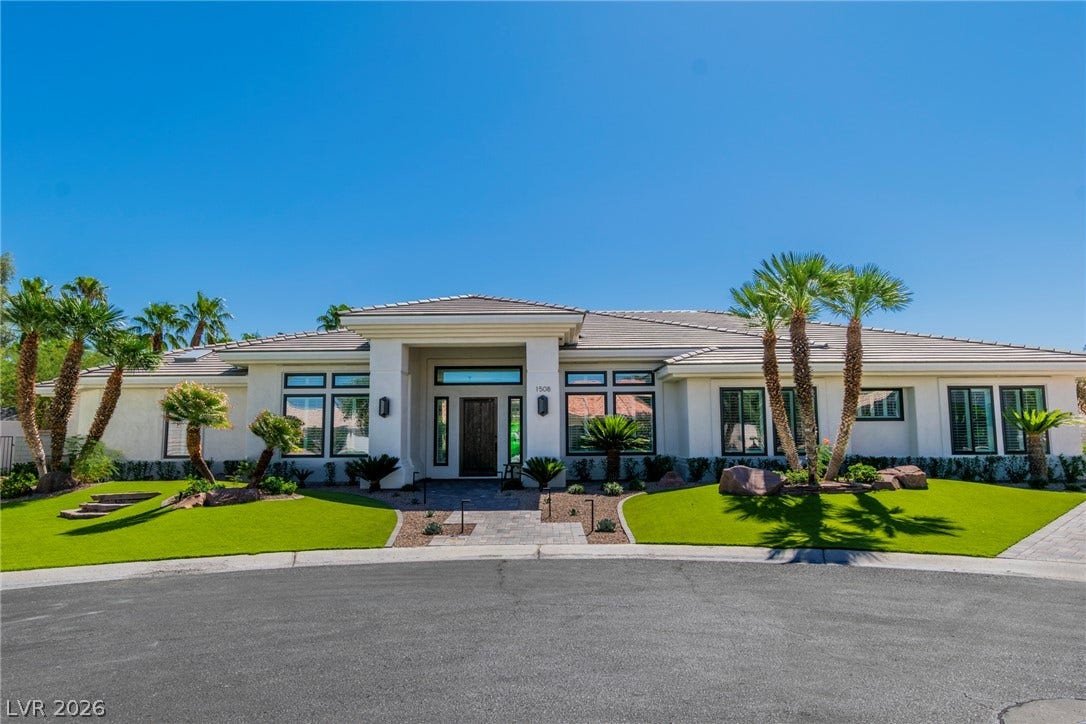 1508 Ten Palms Court, Las Vegas, NV 89117 Lush manicured lawns and palm trees frame the welcoming entrance of this contemporary estate.