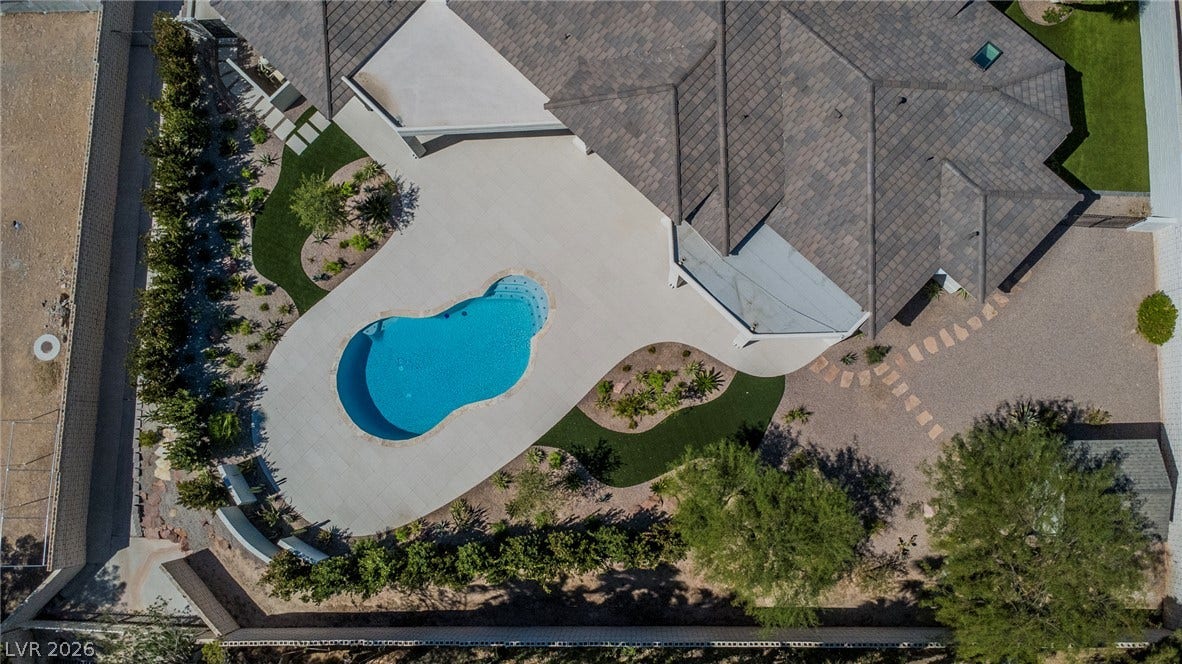 1508 Ten Palms Court, Las Vegas, NV 89117 An aerial perspective reveals a beautifully paved patio area framing a pristine swimming pool.