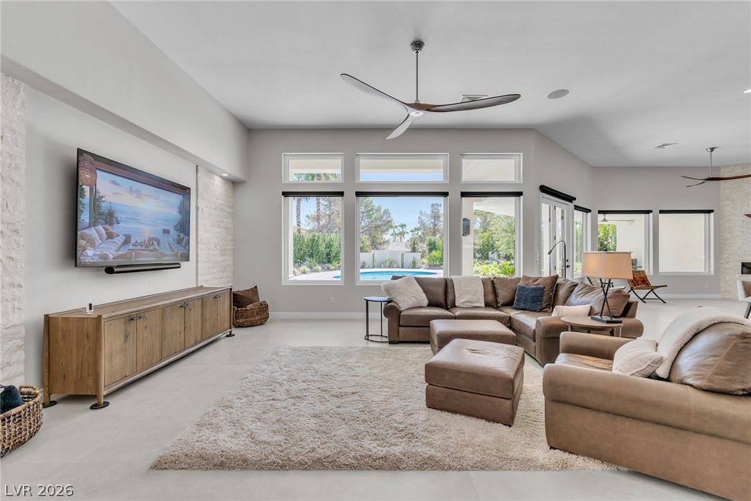 1508 Ten Palms Court, Las Vegas, NV 89117 Gleaming tile floors and soaring ceilings define this light-filled modern living area.