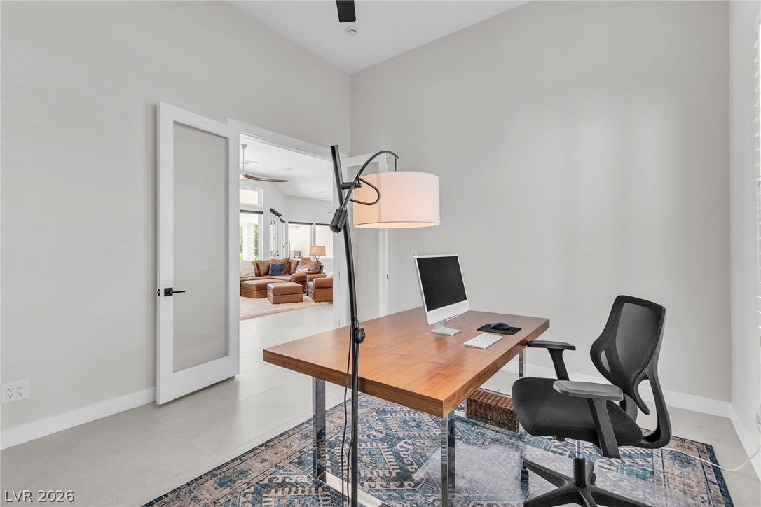 1508 Ten Palms Court, Las Vegas, NV 89117 Double doors open to a light-filled workspace with smooth tile flooring and high ceilings.