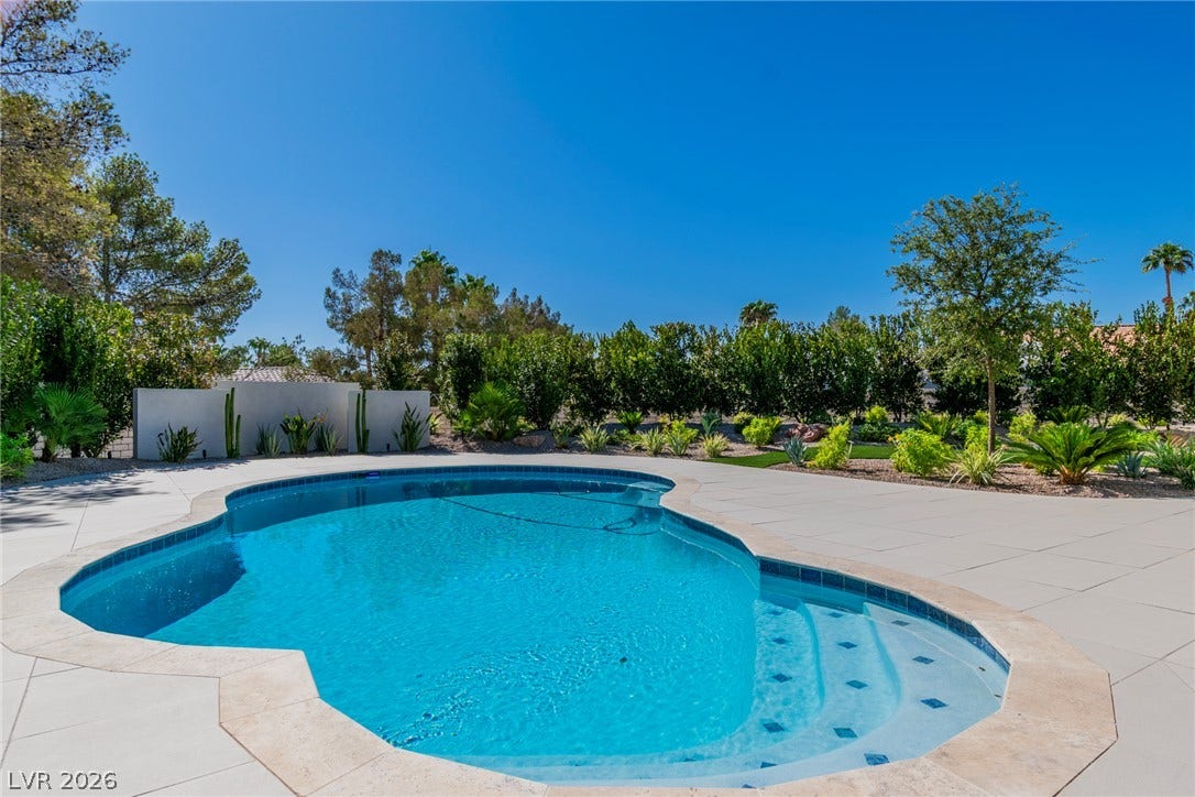 1508 Ten Palms Court, Las Vegas, NV 89117 A pristine swimming pool sits nestled within a beautifully landscaped and private backyard oasis.