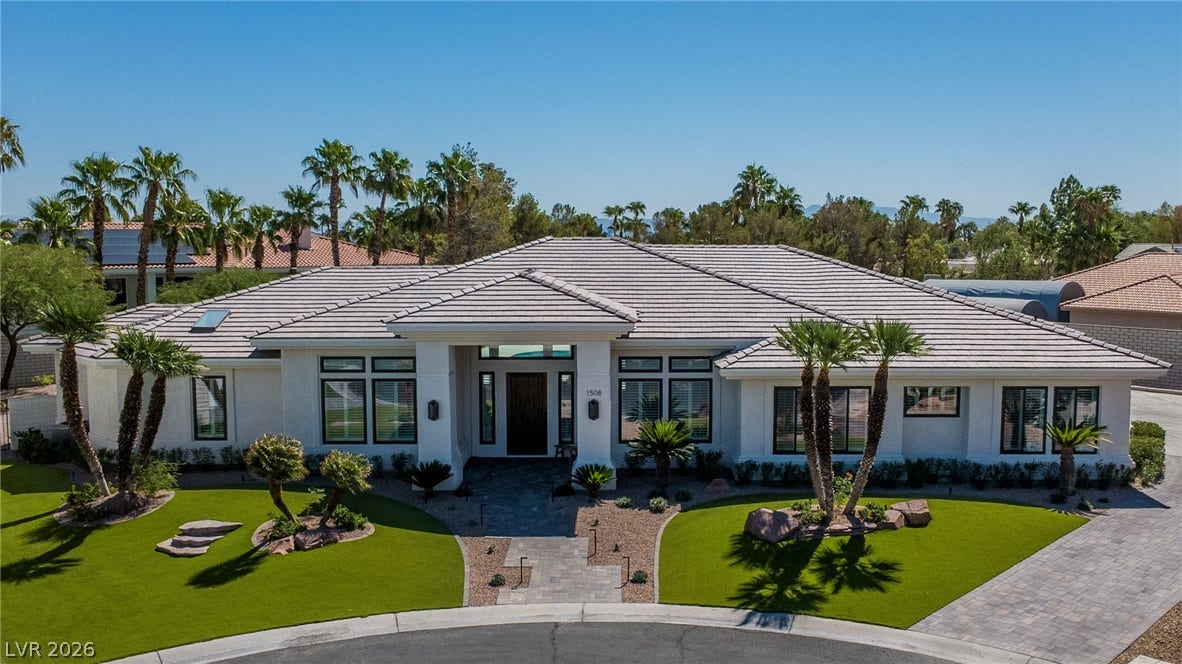 1508 Ten Palms Court, Las Vegas, NV 89117 A classic tile roof and manicured desert landscaping define this elegant single-story home.