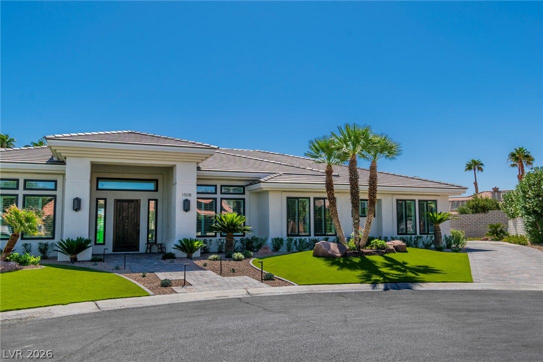 1508 Ten Palms Court, Las Vegas, NV 89117 Manicured desert landscaping frames the elegant entry and sleek architectural lines of this modern home.
