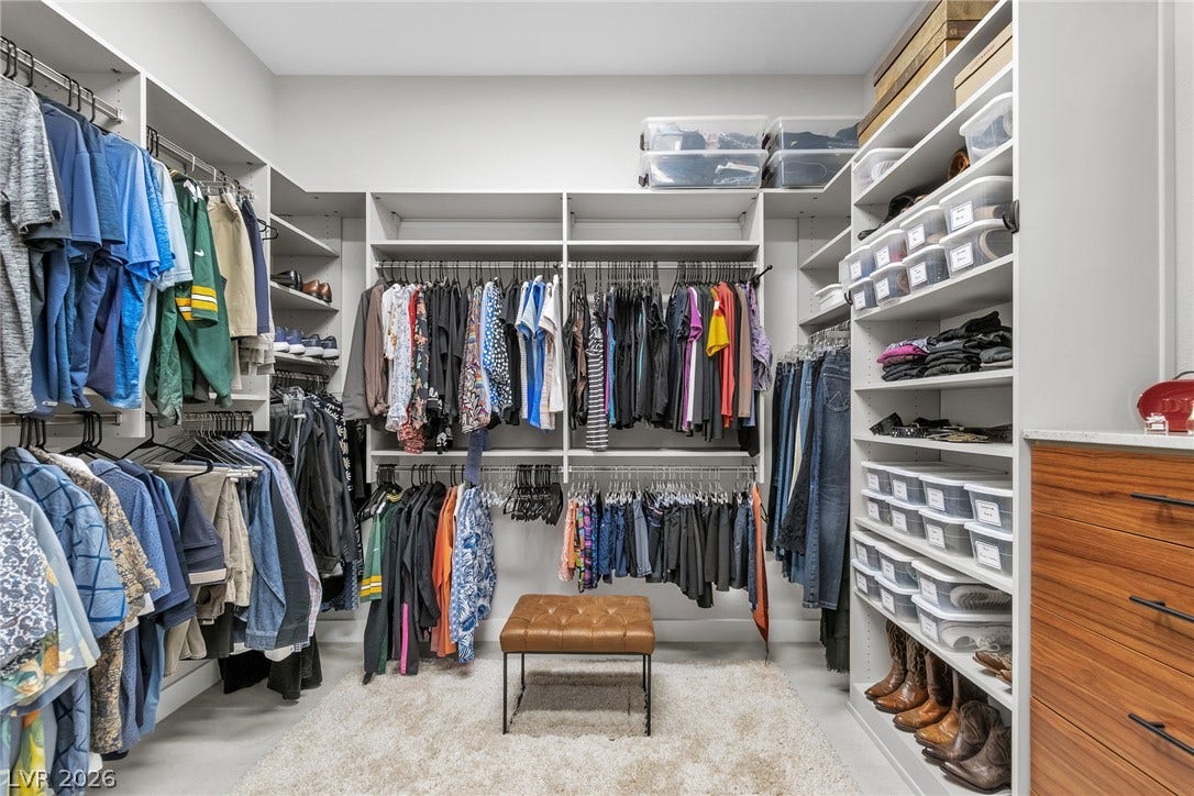 1508 Ten Palms Court, Las Vegas, NV 89117 Custom shelving and hanging rods maximize storage space in this organized walk-in closet.