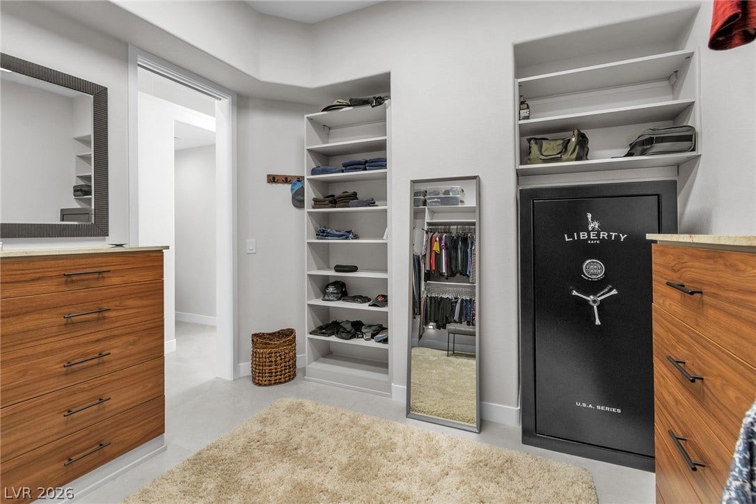 1508 Ten Palms Court, Las Vegas, NV 89117 Custom built-in shelving and ample storage options define this highly functional walk-in closet space.