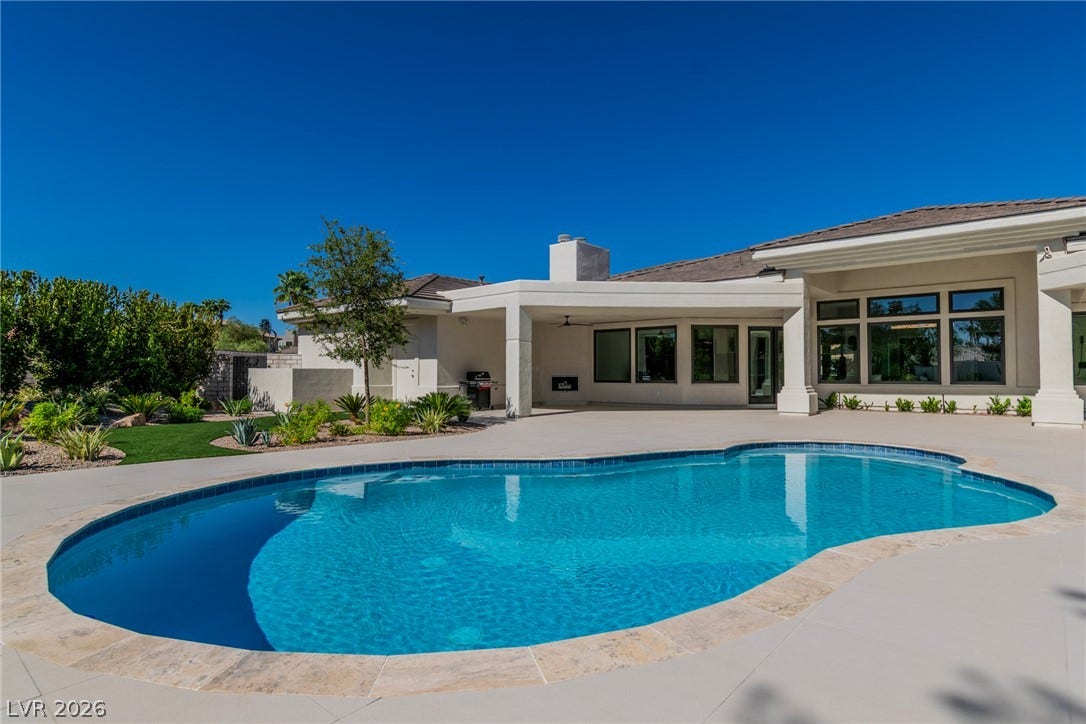 1508 Ten Palms Court, Las Vegas, NV 89117 A pristine swimming pool anchors the expansive backyard terrace of this modern residence.