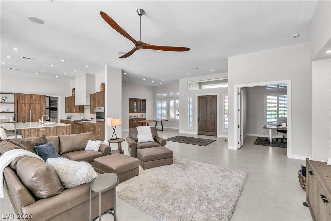 1508 Ten Palms Court, Las Vegas, NV 89117 An open floorplan connects the living spaces under high ceilings and recessed lighting.