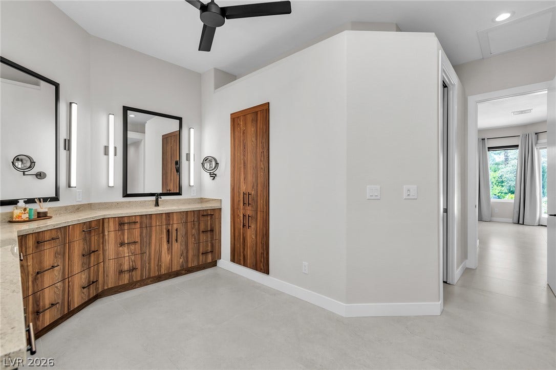 1508 Ten Palms Court, Las Vegas, NV 89117 Clean lines and a spacious dual vanity define this modern primary bath.