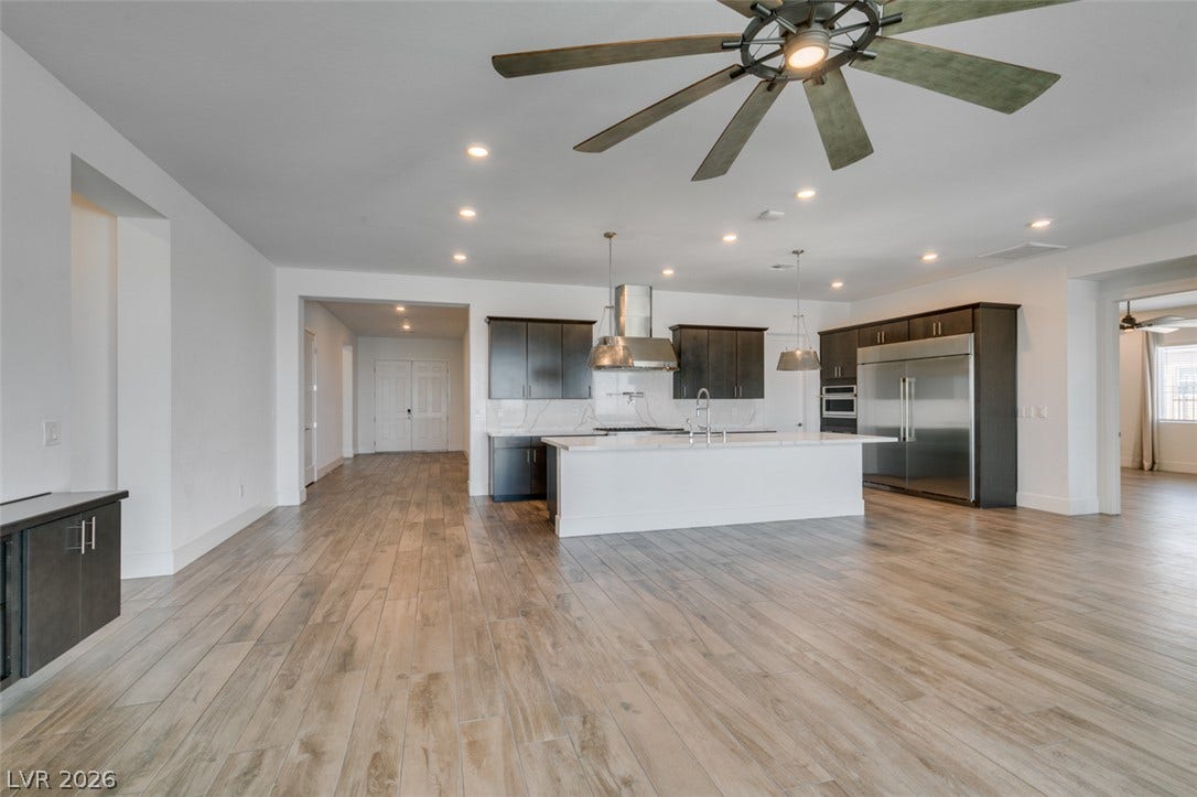 11288 Rebel Dome Court, Las Vegas, NV 89141 An open floorplan seamlessly connects the airy kitchen to the main living areas.