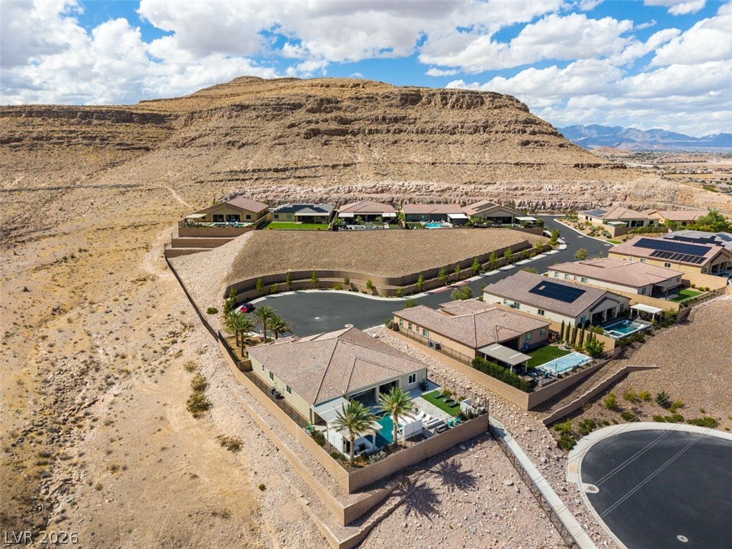 11288 Rebel Dome Court, Las Vegas, NV 89141 Rugged desert mountains provide a dramatic backdrop for this hillside neighborhood of modern homes.