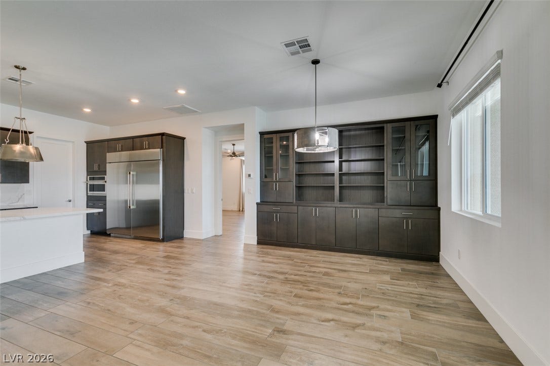 11288 Rebel Dome Court, Las Vegas, NV 89141 An open floorplan connects the versatile dining area to the kitchen and integrated cabinetry.
